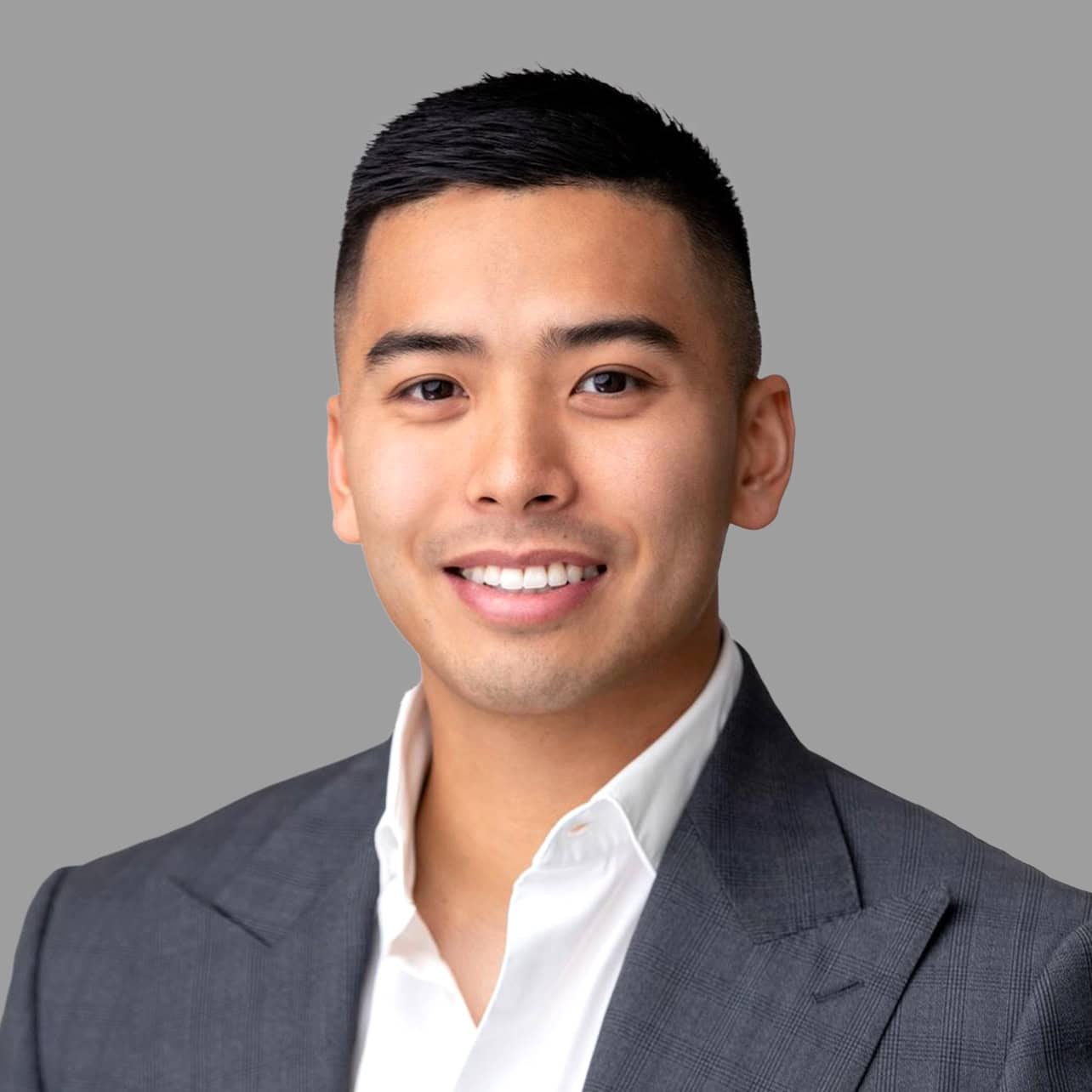 Professional portrait of Luke Bonham in a suit for Verified Capital.