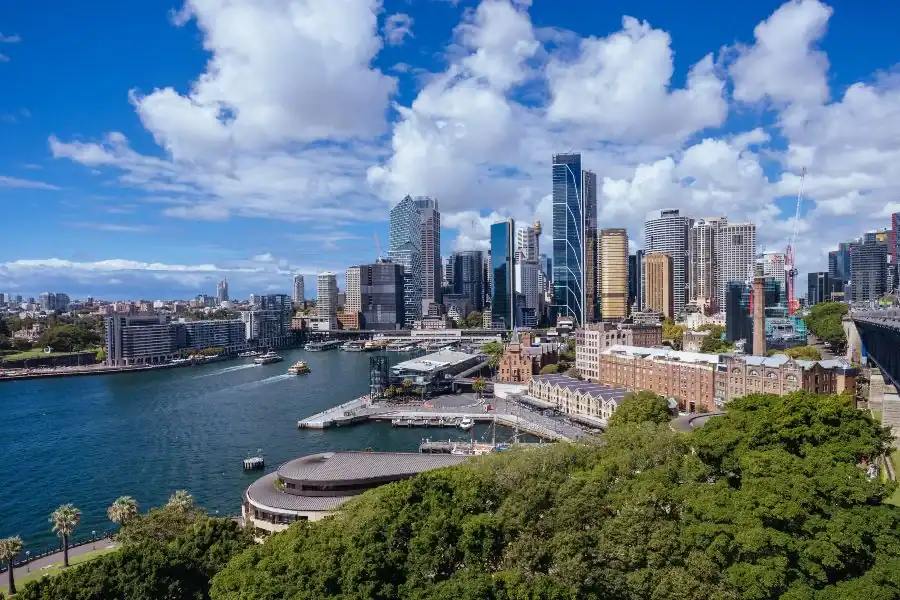 Downtown skyline with skyscrapers and waterfront in a vibrant cityscape.